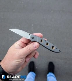 WE Knife Co. Schism Frame Lock Knife Gold Holes (2.8" Stonewash) 908A -We Knife Co. WE Knife Co Schism Frame Lock Knife Gold Holes Stonewash 908A BHQ 97974 kp in hand web 2